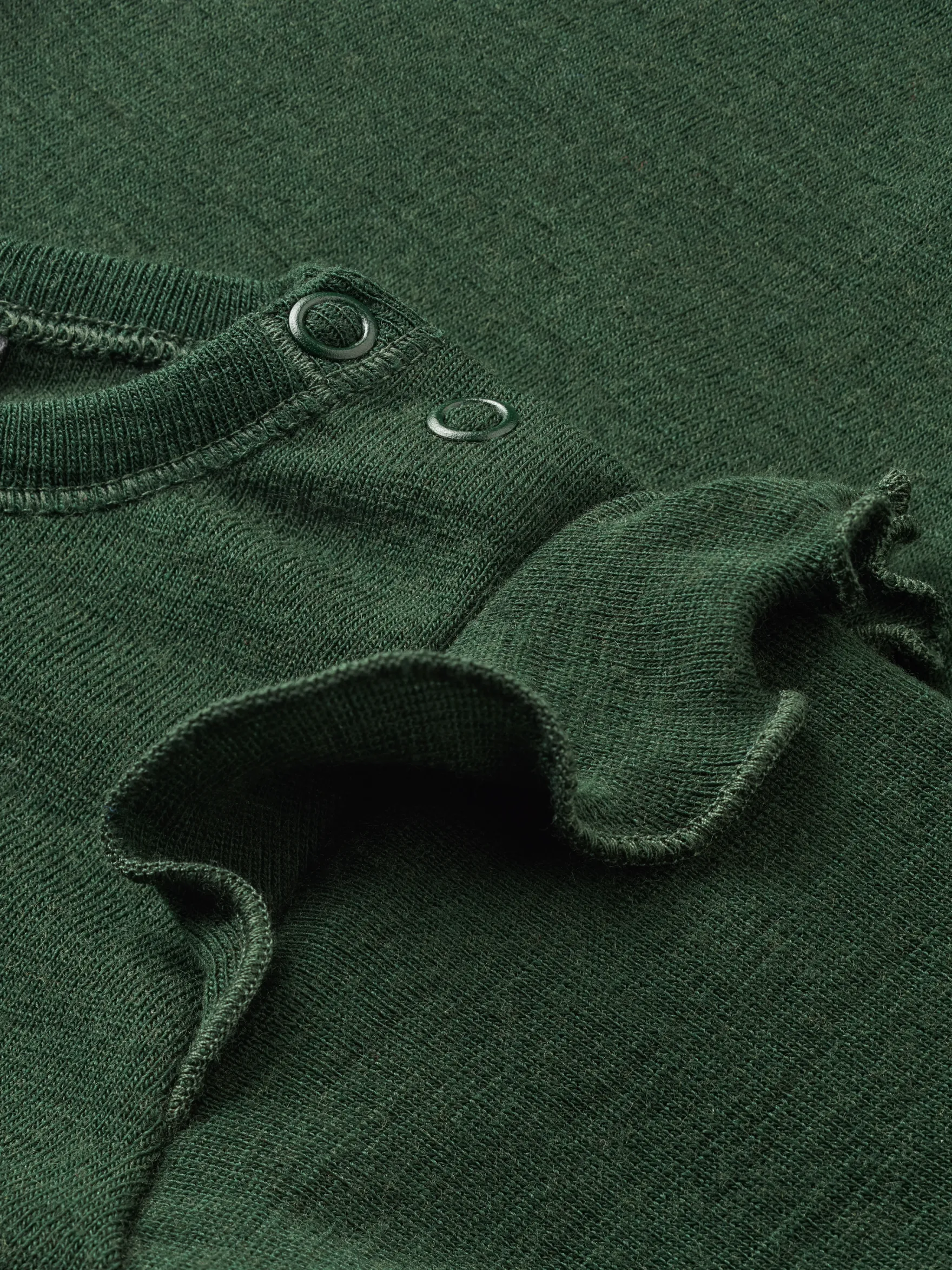 Bluse i merinould til baby
