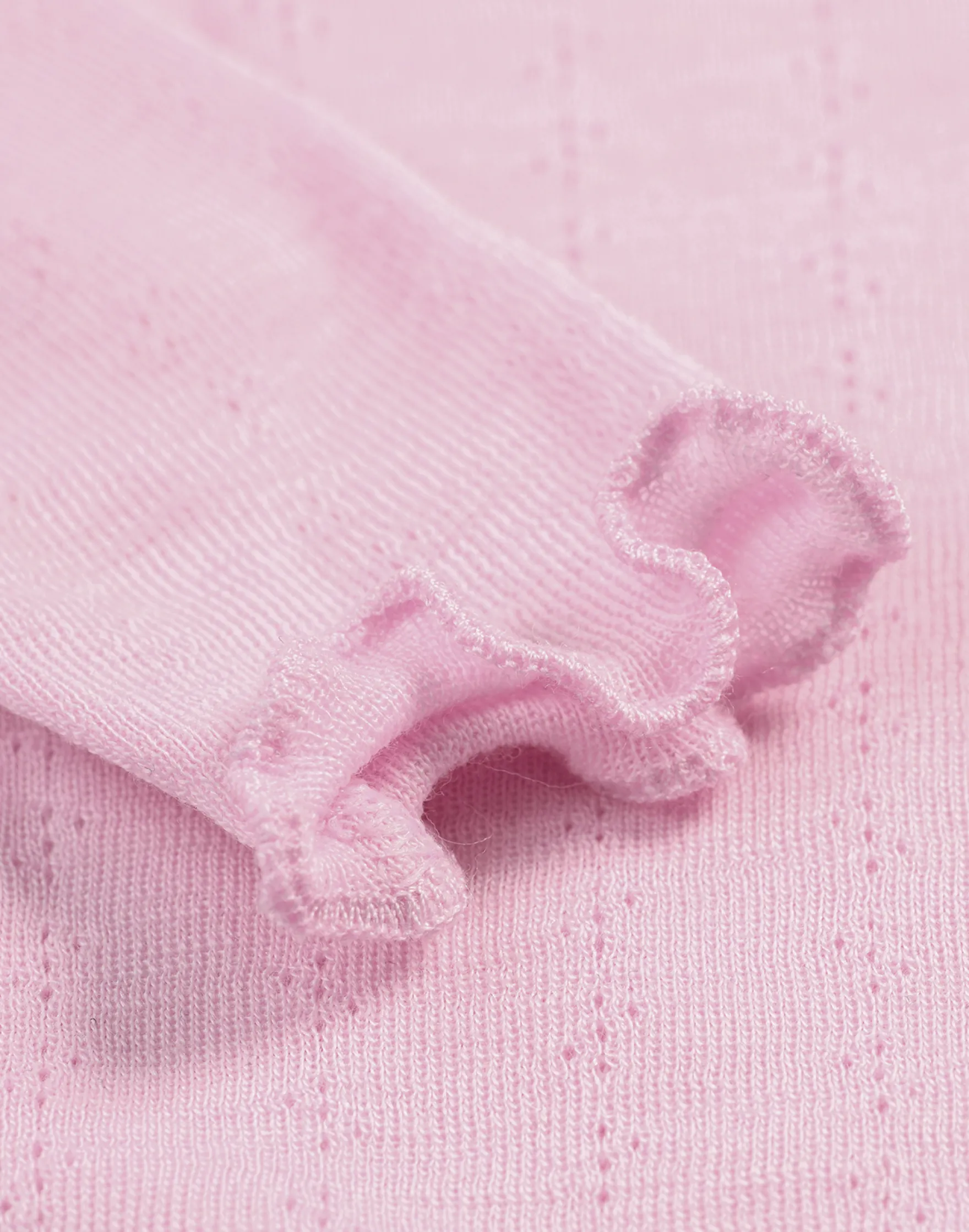 Bluse med hulmønster i merinould/silke til baby